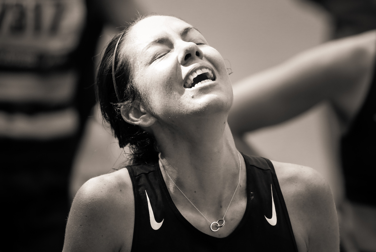 Woman Crossing Finish Line of the 2021 Boston Marathon by Ben Garvin