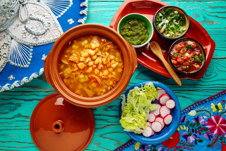 Pozole with mote big corn stew from Mexico with ingredients and appetizer