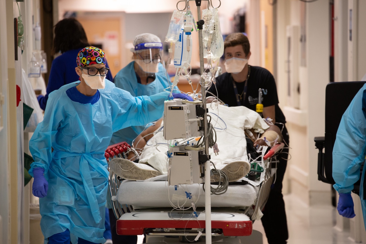 COVID Patient Being Wheeled Into the ICU