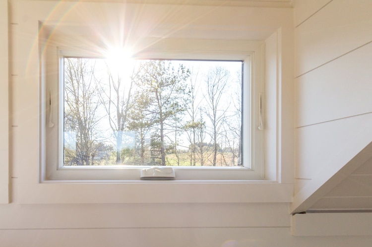 This Tiny Home Comes With a Greenhouse and Porch Swing