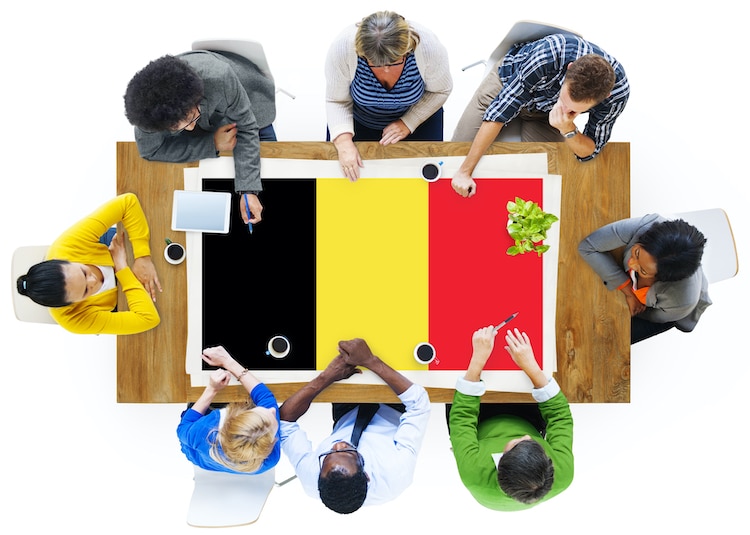 Workers at Table With Belgium Flag