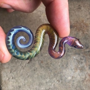 Artist Casts Small Multicolored Snake Figurines From Glass