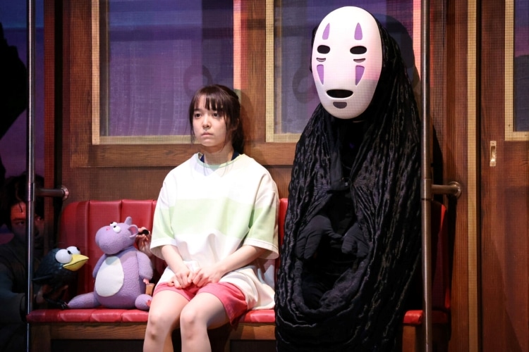Chihiro Riding Train with No-Face in Stage Production of Spirited Away
