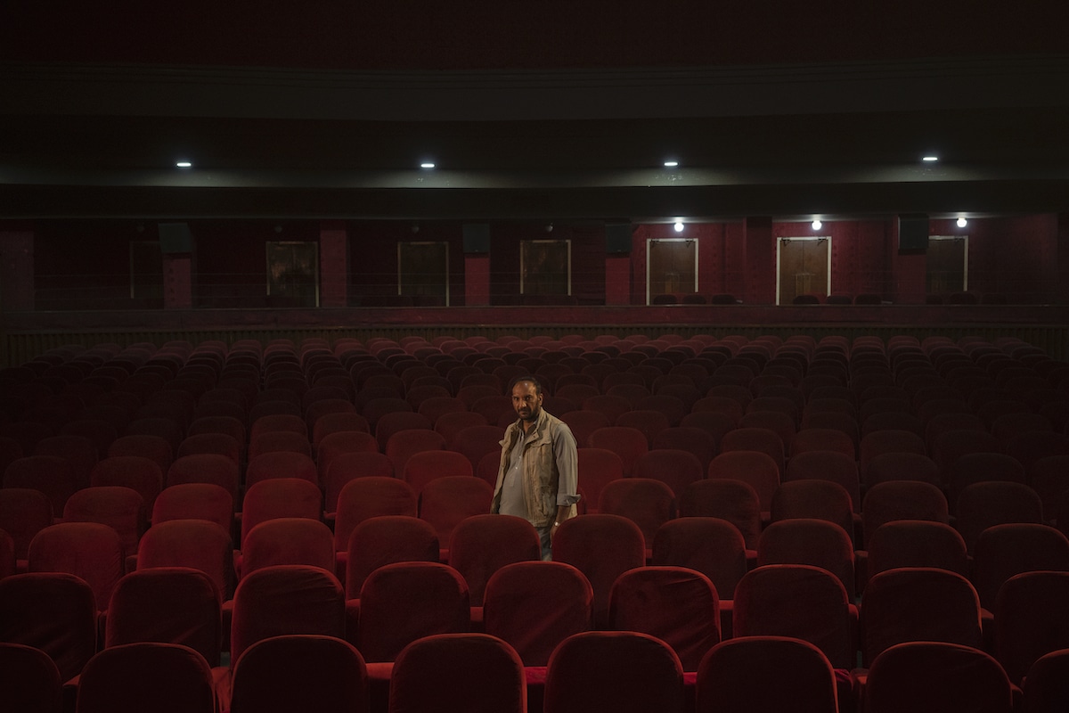 Usher Standing in Empty Cinema in Kabul