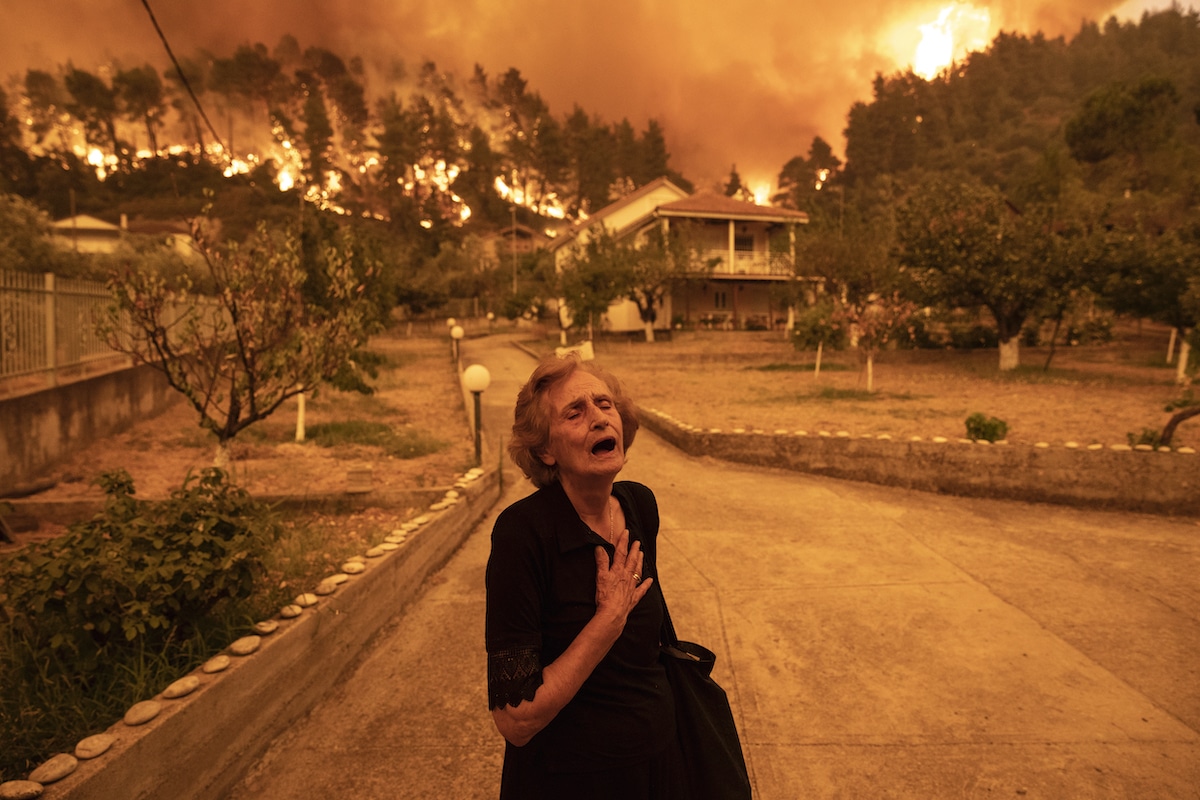 Greek Woman Crying as Wildfire Approaches Her Home