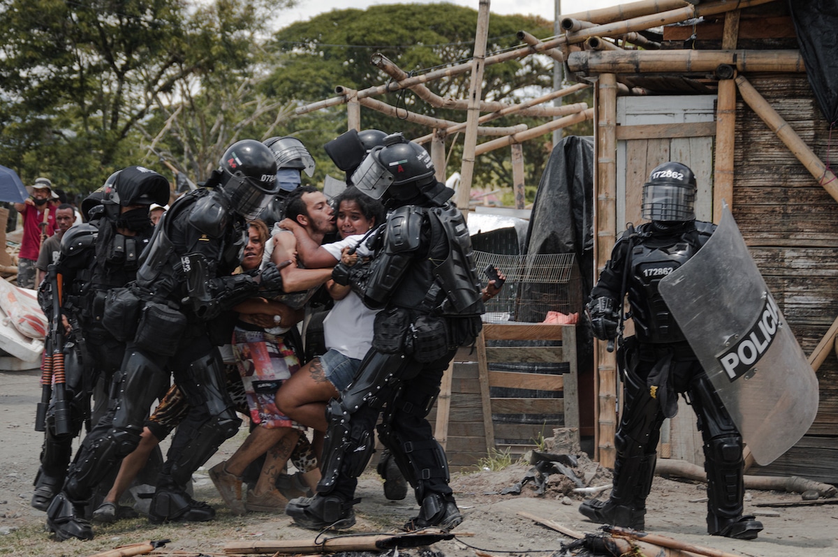 Police Arresting Man and His Wife During San Isidro Eviction in Colombia