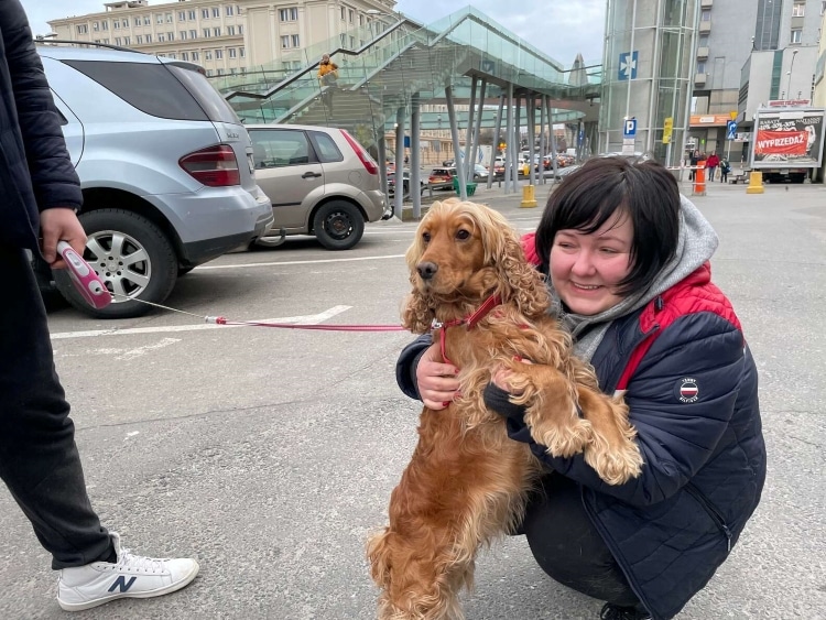 Ukrainian girl with her pet cocker spaniel