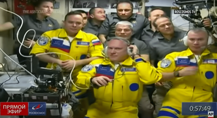 Russian Cosmonauts Wearing Yellow Uniforms on ISS