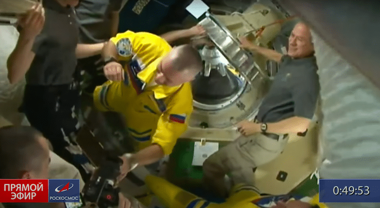 Russian Cosmonauts Wearing Yellow Uniforms on ISS