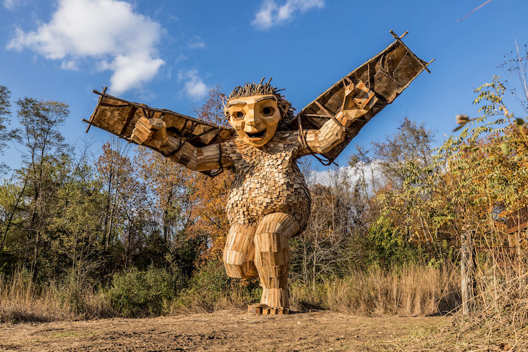 Giant recycled wood sculptures of trolls Welcome guests in the great ...