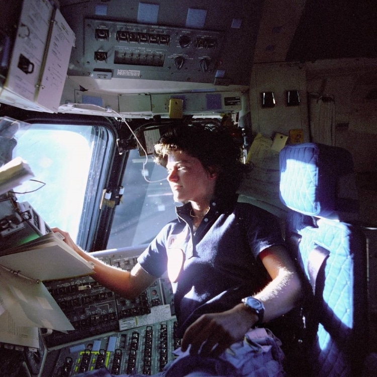 Sally Ride Looks Out the Window of the Space Shuttle