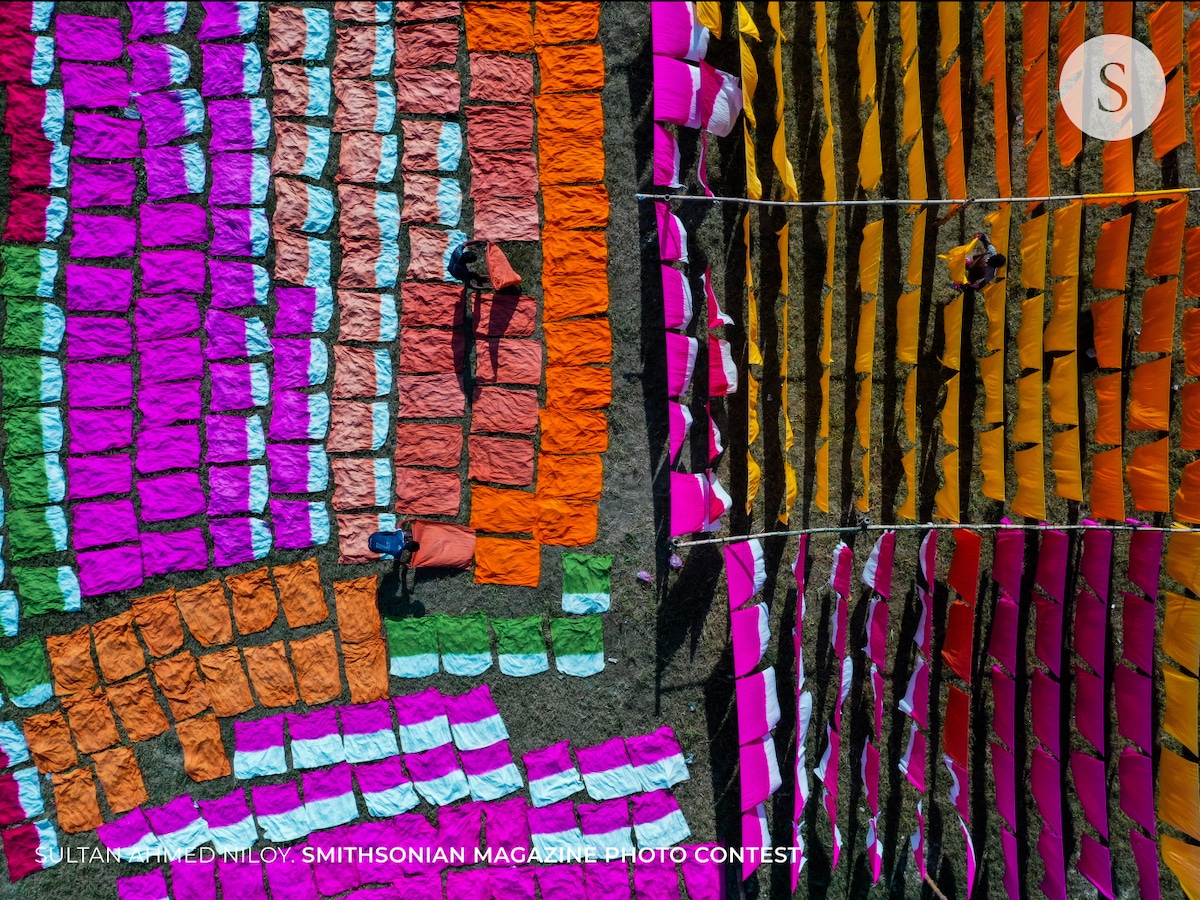 Aerial View of Workers in Bangladesh Hanging Strips of Cotton to Dry