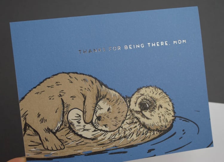 mother's Day card featuring two otters embracing with the message "thanks for being there, mom"