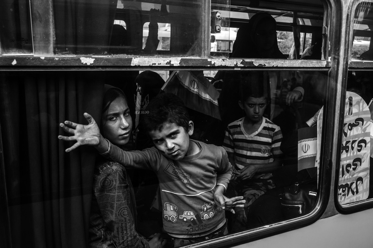 Black and White Photo of Kids on a Train