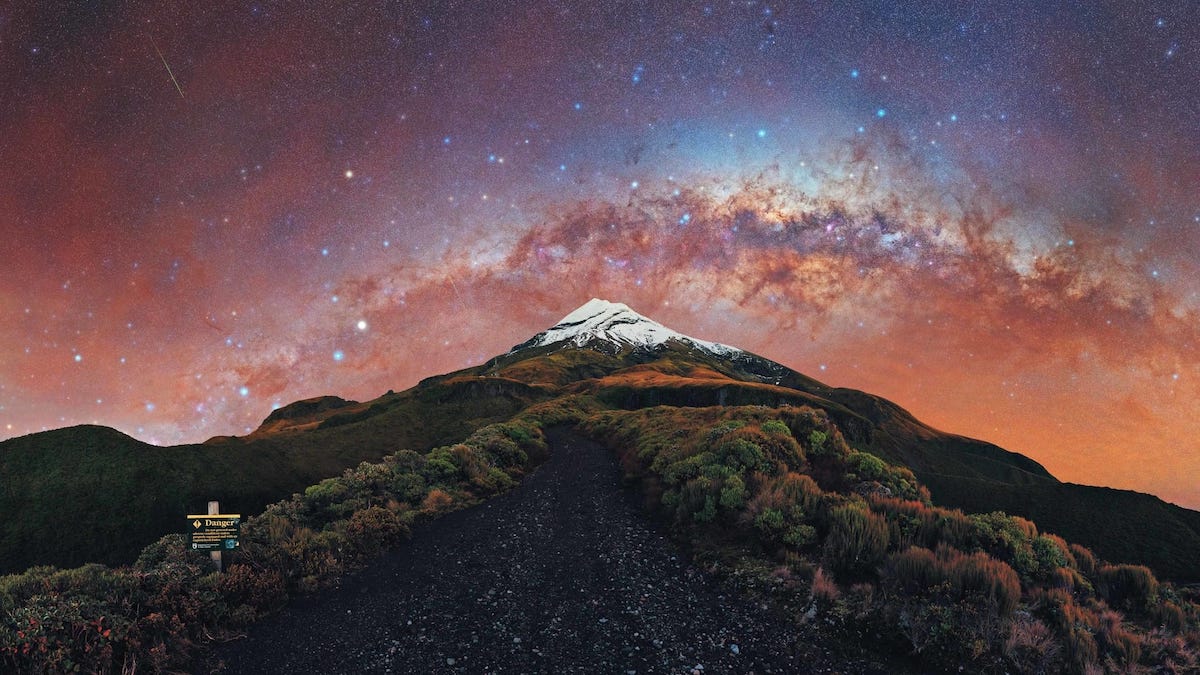 New Zealand's Mount Taranaki under the arch of the setting Milky Way