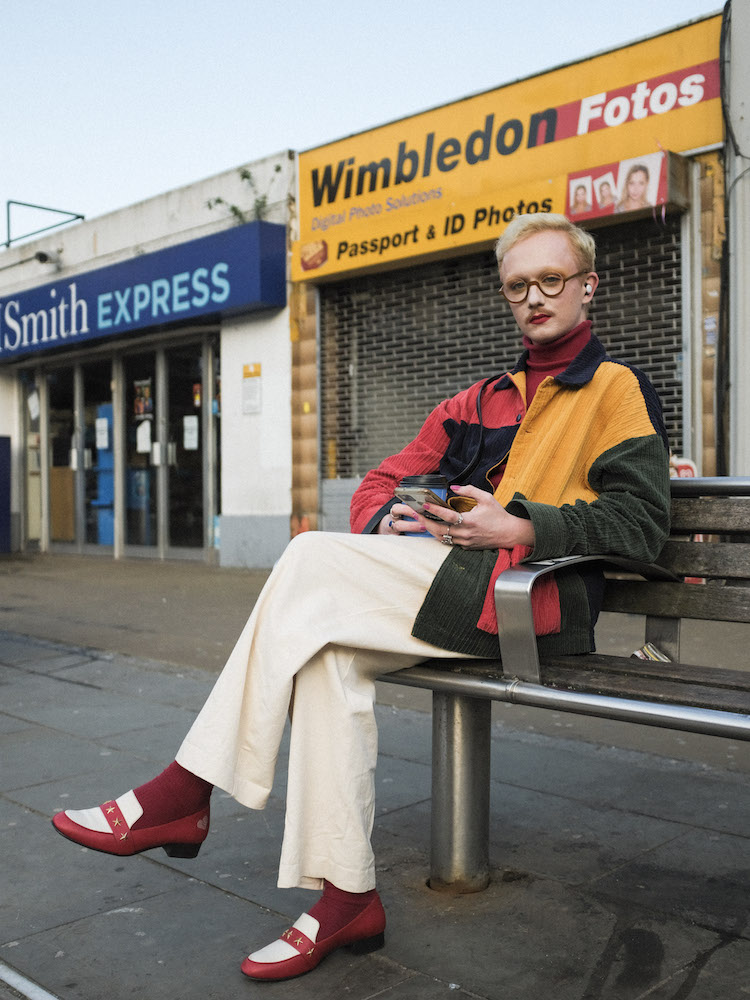 Fashionable Guy Sitting on a Bench