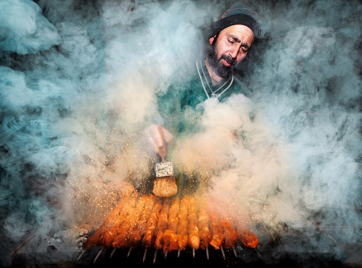 Man in India Cooking Kebabs