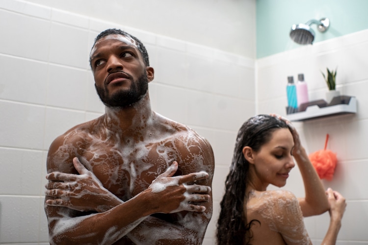 Couple Showering, One Person Cold