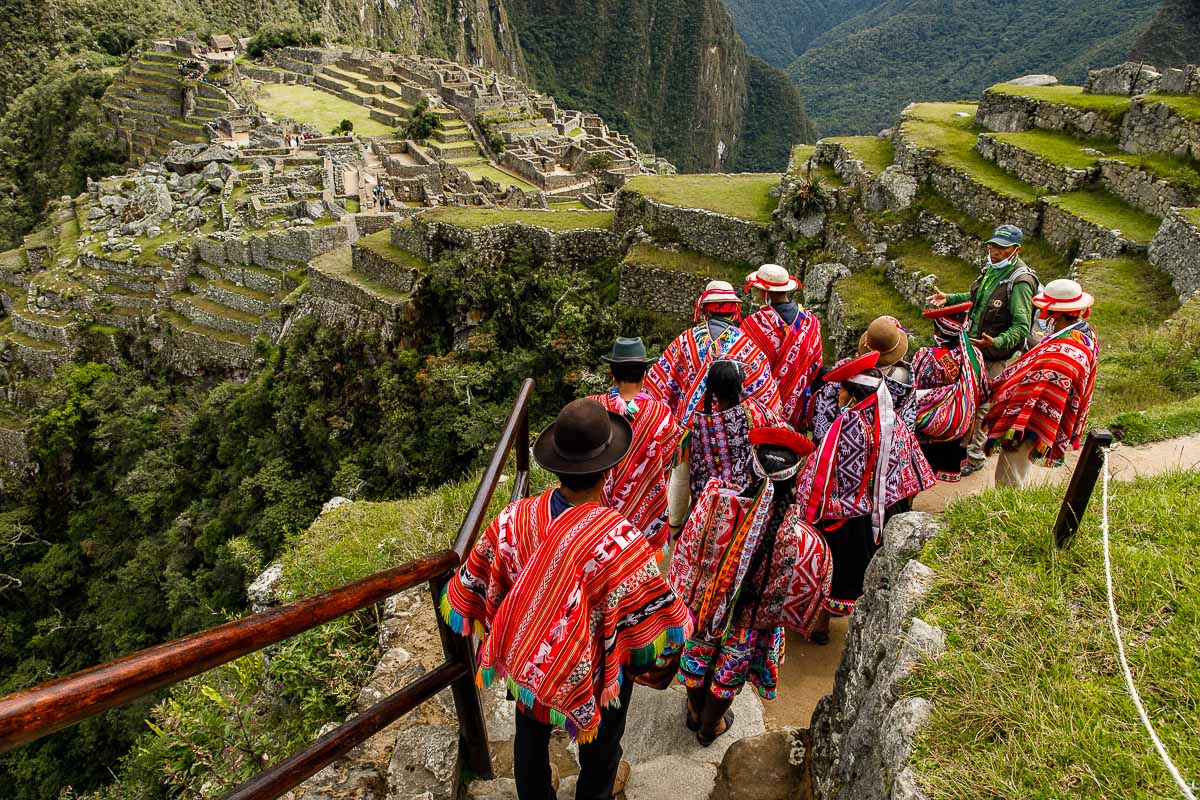 Group of Quechua Getting a Tour of Machu Picchu