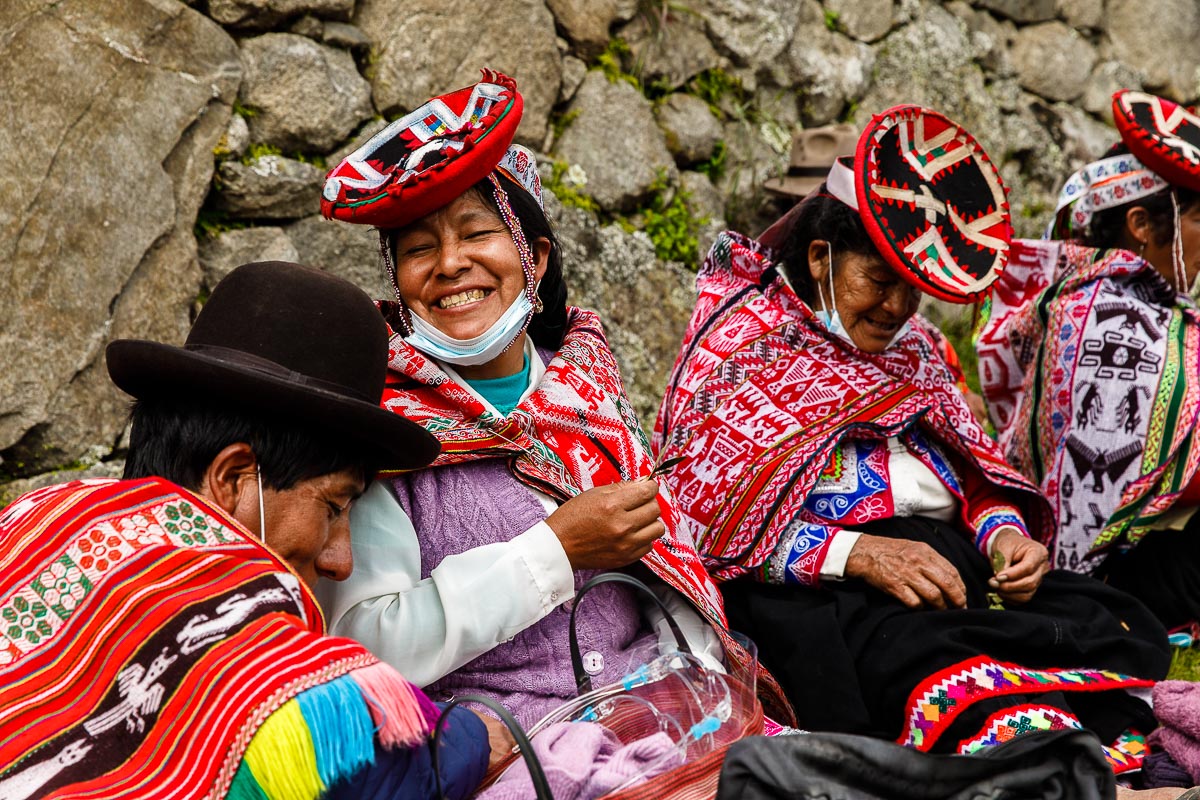Pauline and other Quechua families take a cocoa leaf break on a plateau above Machu Picchu near the “care-takers” hut.