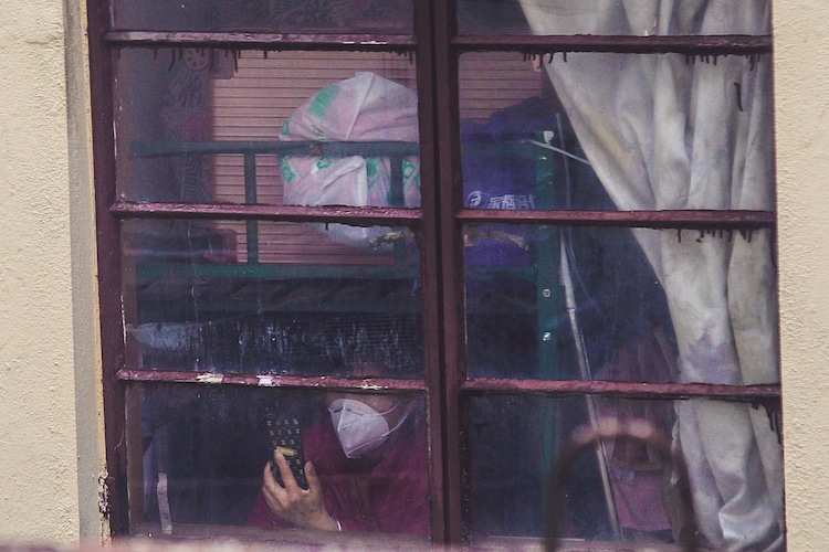 Person at their Window During the Shanghai Lockdown 