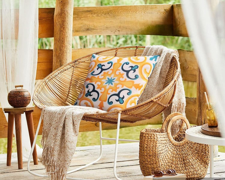 Blue & yellow pillow on a tropical lounge chair