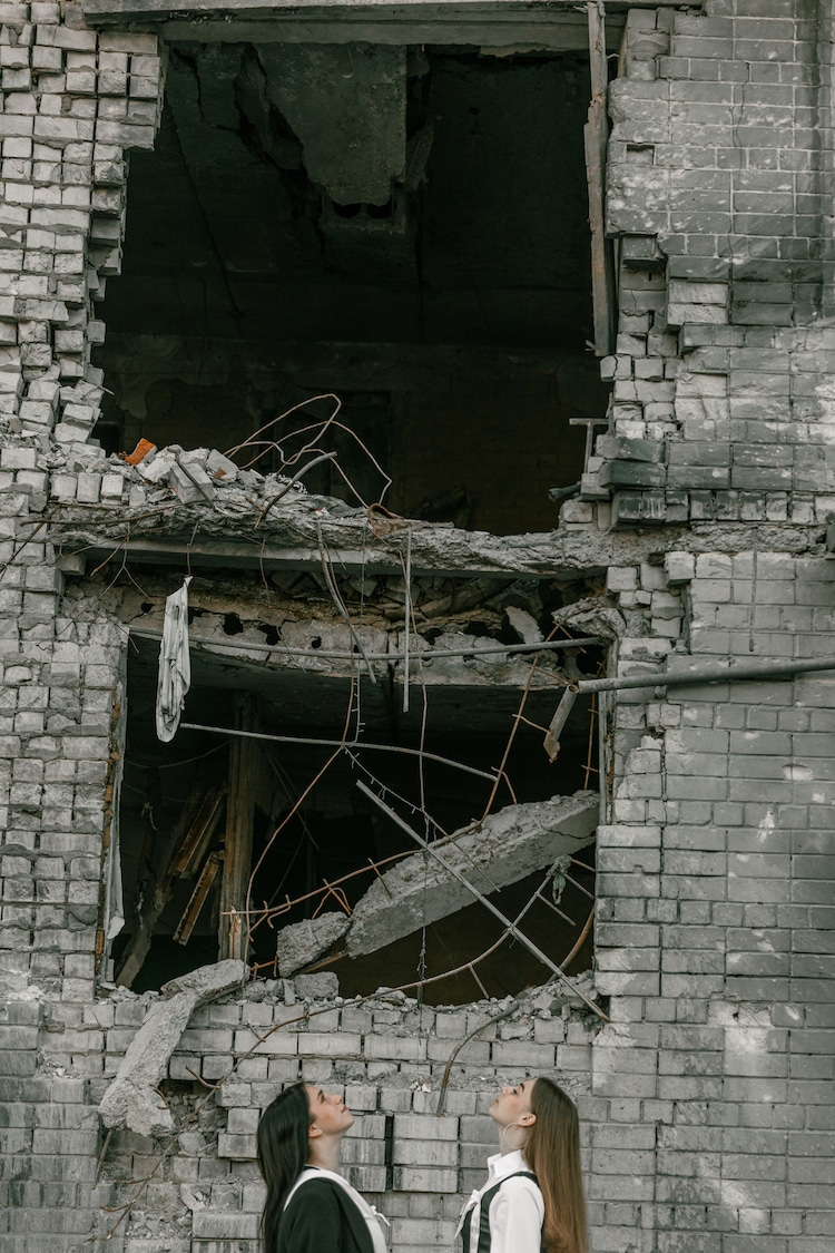 Graduation Photos of Students in Ukraine Standing in Ruins of War