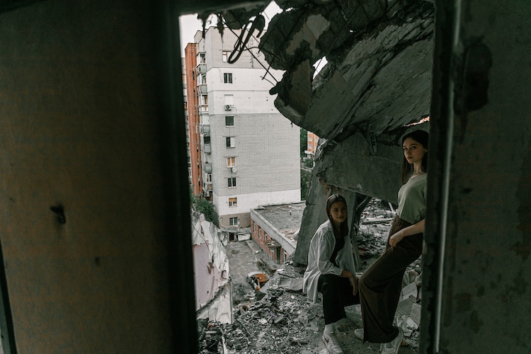 Ukrainian Students Standing in Bombed Building