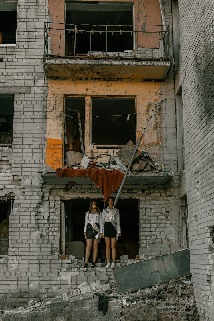 Graduation Photos of Students in Ukraine Standing in Ruins of War