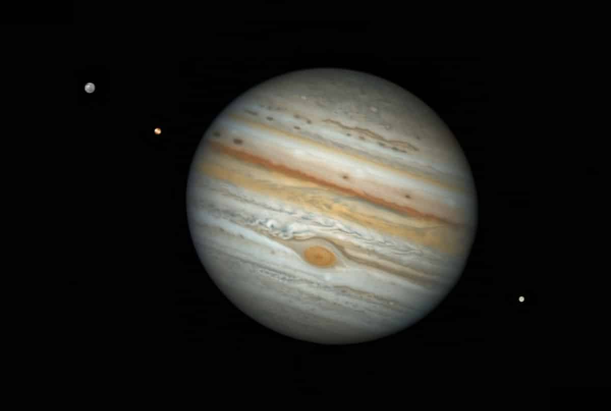Jupiter with Three of Its Moons