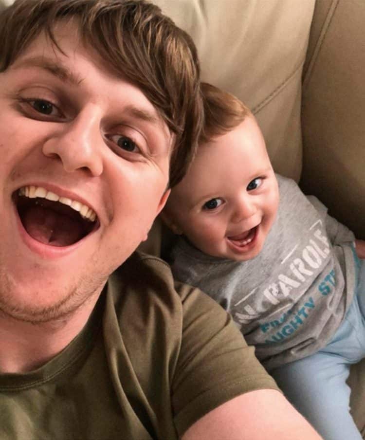 Man and Baby Smiling Looking at Camera