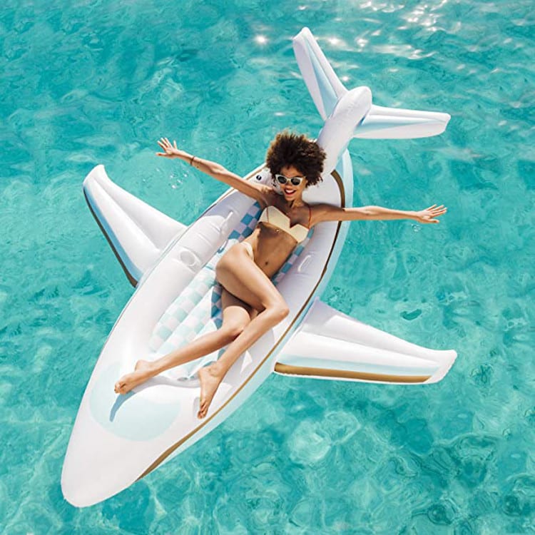 Woman using a plane pool float