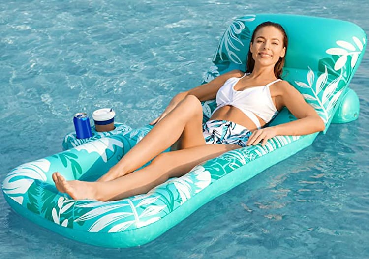 Woman laying on lounger pool float
