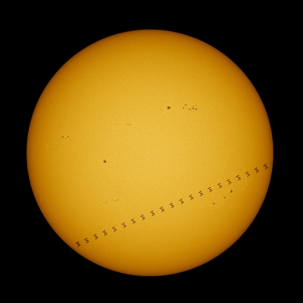 International Space Station passes in front of The Sun