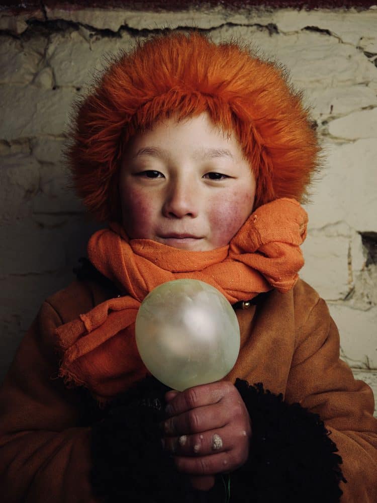 Portrait of a Chinese Girl Wearing a Red Furry Hat