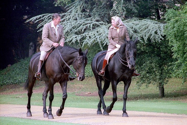 President Ronald Reagan riding horses with Queen Elizabeth II during visit to Windsor Castle in 1982