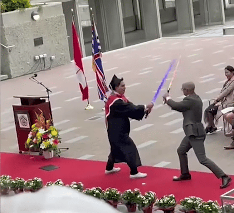 Student Brings Light Sabers to Graduation