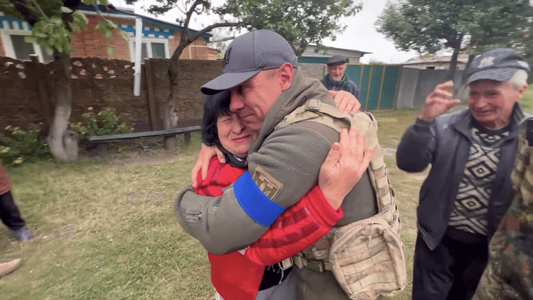 Ukrainian Mom Rushing to Greet Her Son Returning from the War