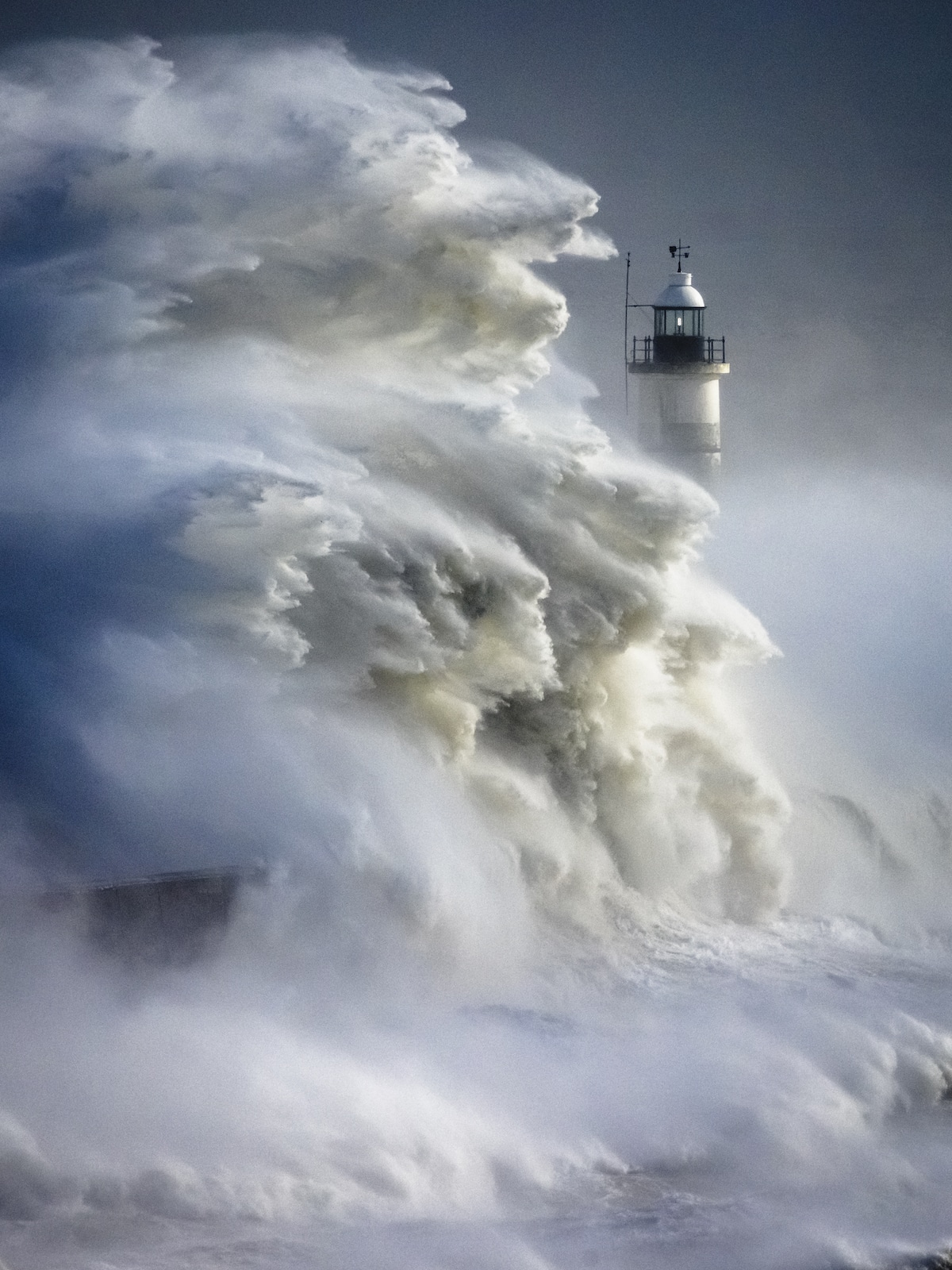 Waves from Storm Eunice Battering Lighthouse in Newhaven, UK