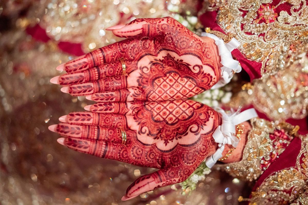 Asian Bride Showing Off Her Henna Hands