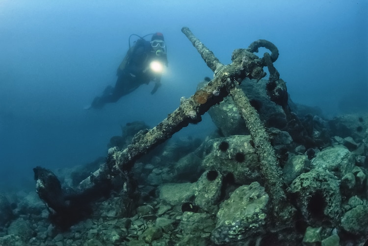 Diver Exploring a Shipwreck