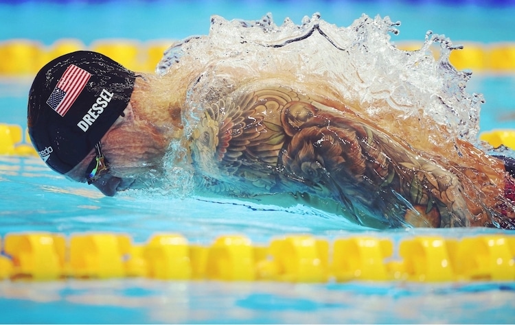 Caeleb Dressel of Team United States is seen in action on his way to winning the Men’s 100m Butterfly final at Tokyo Aquatics Centre