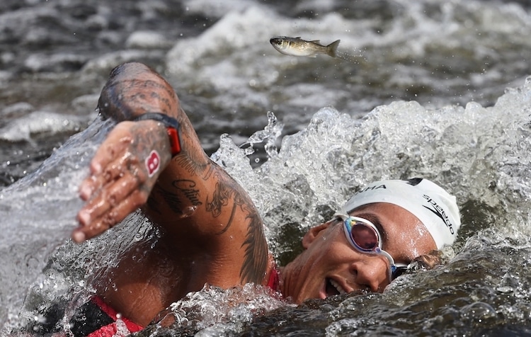 Brazilian Olympic gold medalist swimmer Ana Marcela Cunha competes in the Women’s 10km Marathon Swimming Final