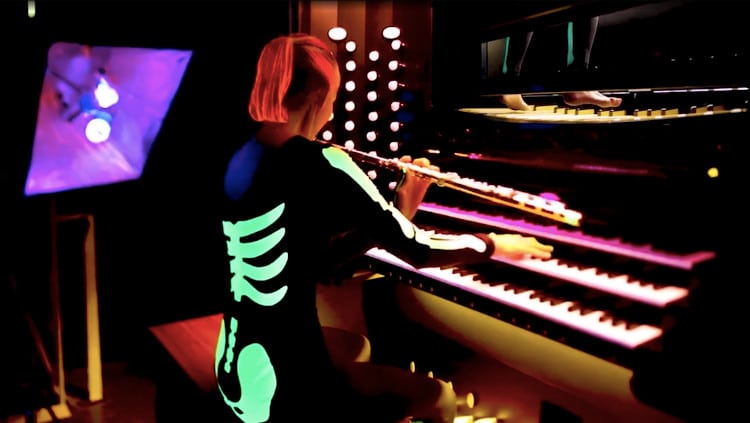 Musician Plays ‘Danse Macabre’ in an Eery Organ and Flute Duet With Herself