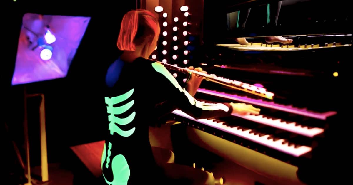 Musician Plays an Eery 'Danse Macabre' on Organ and Flute