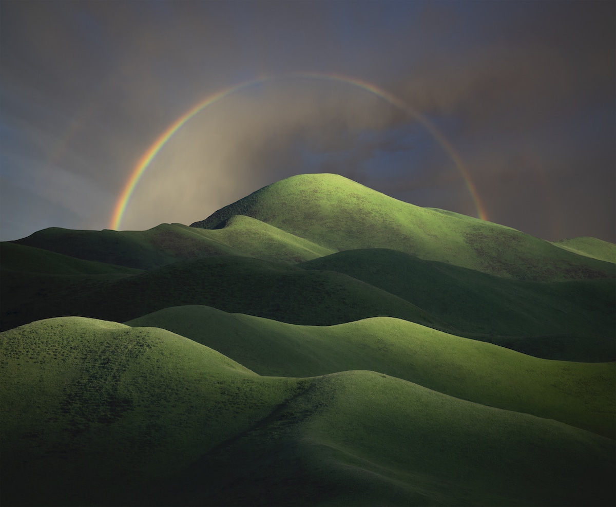 Rainbow Over a Lush Green Landscape