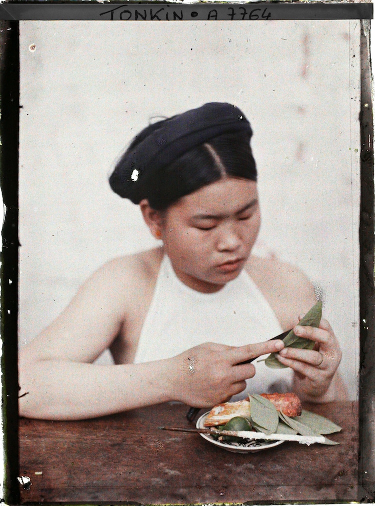 A young woman splitting the betel leaf in Hanoi
