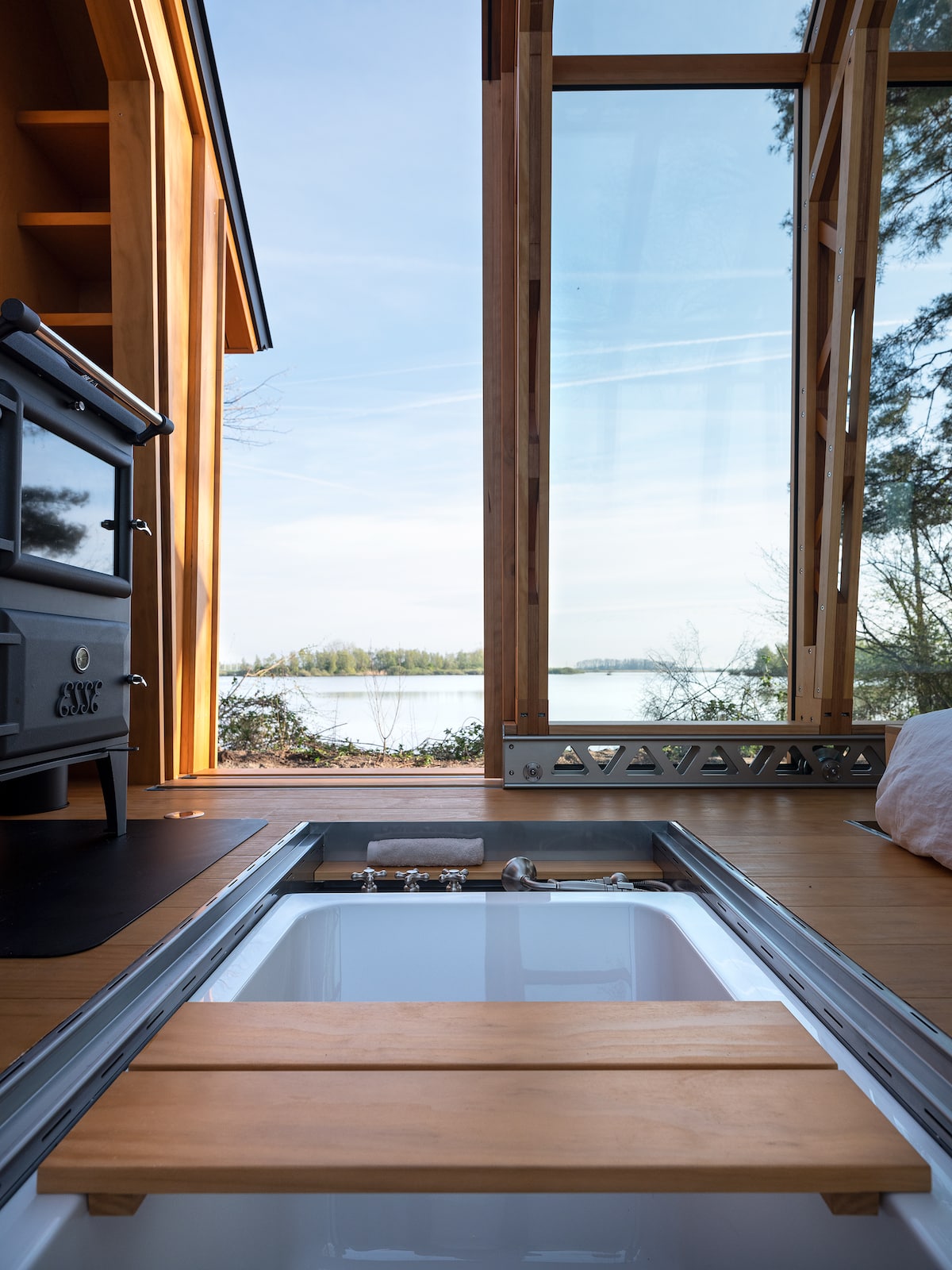 Soaking Tub Integrated into the Floor of a Cabin