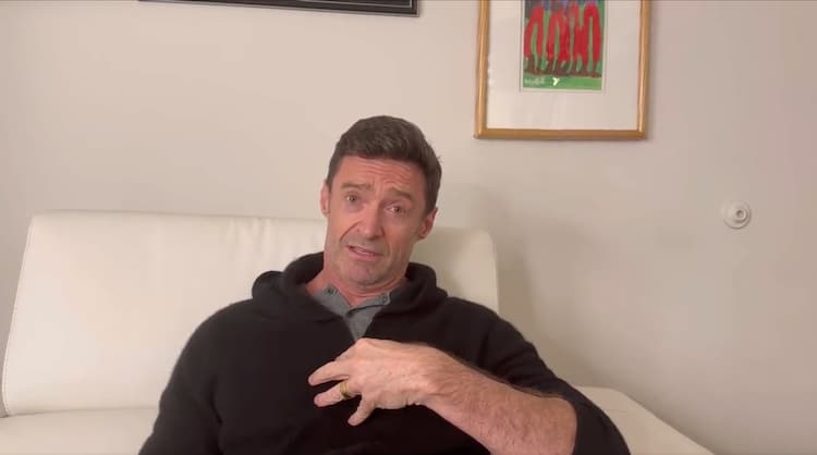 Hugh Jackman holding his hand to his chest, begging the Academy not to nominate Ryan Reynolds in funny video