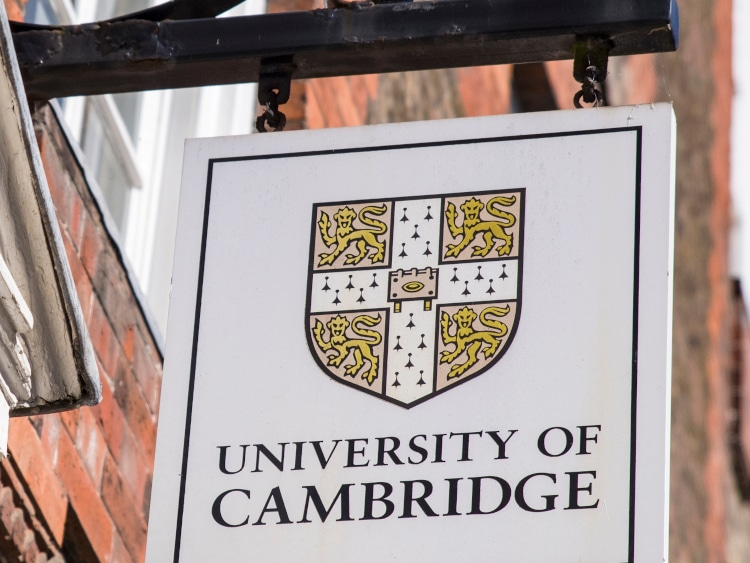 street signage featuring the logo of Cambridge University